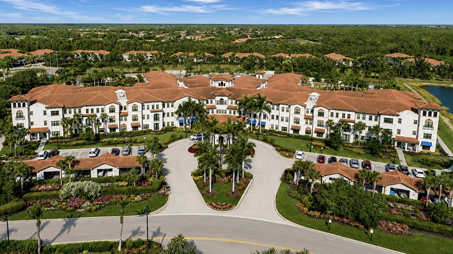 Aerial view of American House Coconut Point, a senior living community in Estero, FL