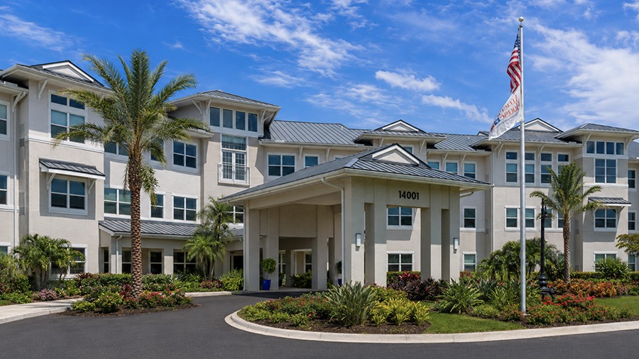 Driveway and front entrance at American House Ft. Myers assisted living and memory care facility in Fort Myers, FL
