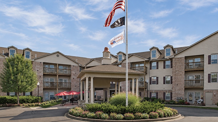 Front entrance of American House Milford, a senior living facility in Oakland County, MI