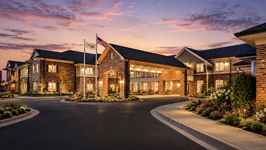 Front entrance at sunset at American House Mount Prospect assisted living and memory care facility in Mt. Prospect, IL