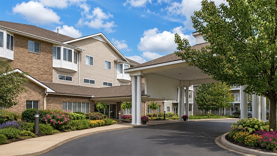 Front exterior and car port at American House Southland, a retirement home, in Taylor, MI