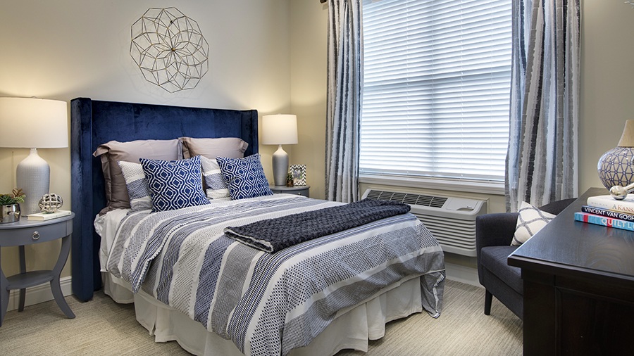 Model bedroom in an apartment at American House Burlington Creek Assisted Living and Memory Care Facility in Kansas City, MO