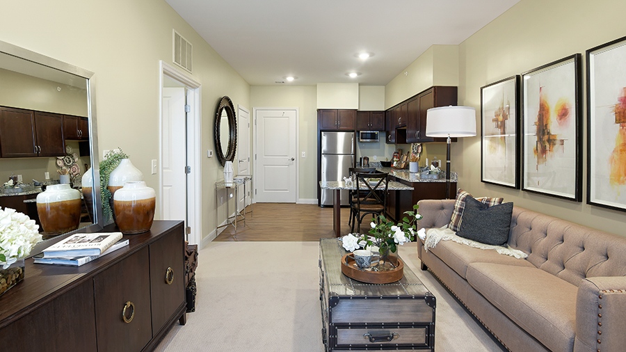 Model apartment with kitchen and living room at American House Hampton Village assisted living and memory care facility in Rochester Hills, MI