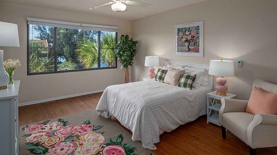 Bedroom in an apartment at American House Sarasota Senior Living Community