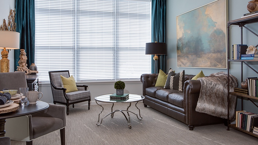 Living room at an apartment at American House Somerset assisted living and memory care facility in Troy, MI