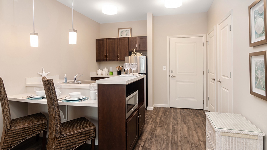 Model kitchen in an assisted living apartment at American House Ft. Myers assisted living and memory care facility in Fort Myers, FL
