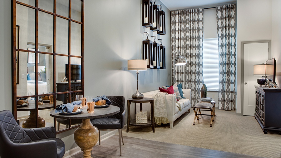Living room in an apartment at American House Town and Country memory care and assisted living facility in Town and Country, MO
