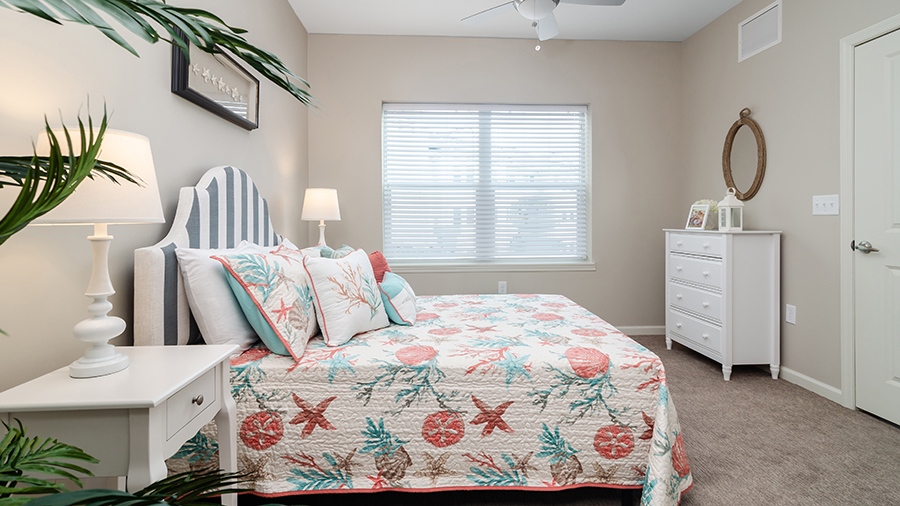 Model bedroom in an assisted living apartment at American House Ft. Myers assisted living and memory care facility in Fort Myers, FL
