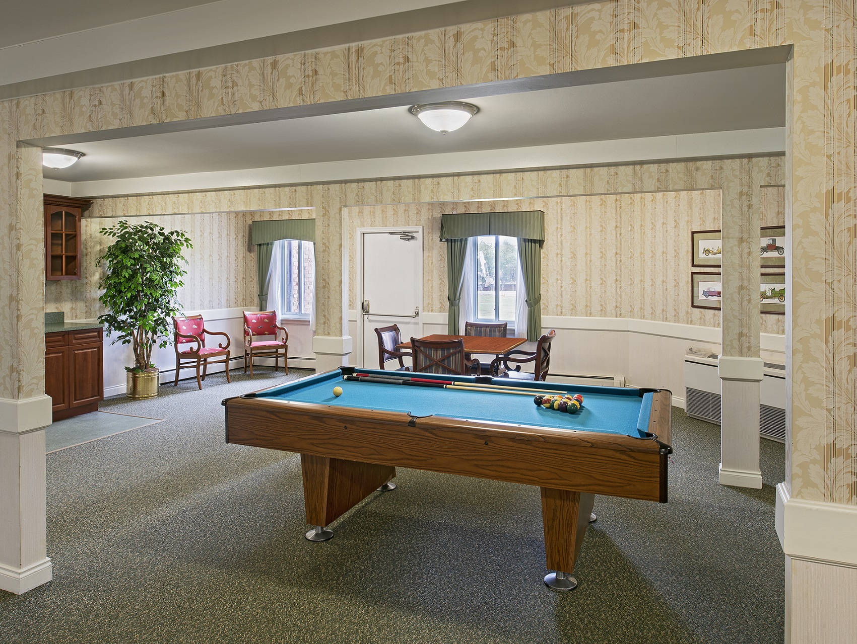 Game room at American House East II, a senior living facility in Roseville, MI adsf