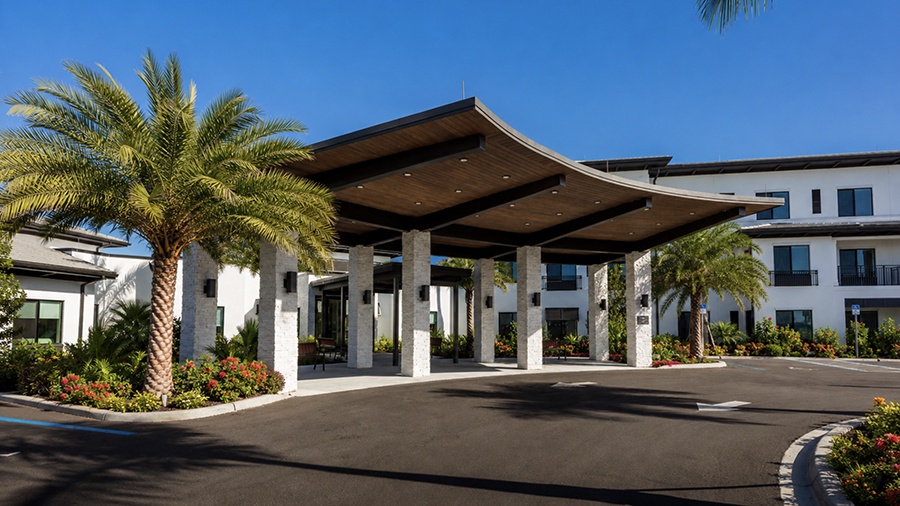 Driveway and front entrance at American House Naples memory care and assisted living facility