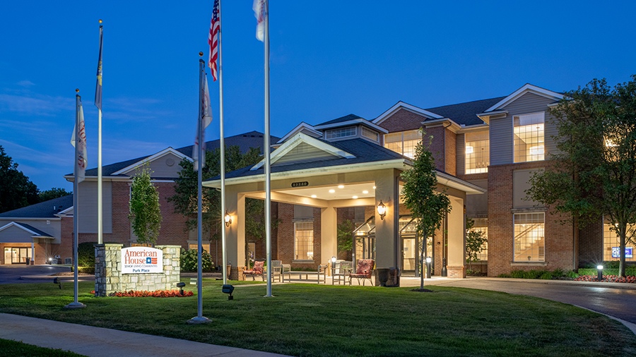 Evening photo of front entrance of American House Park Place senior living facility in Warren, MI