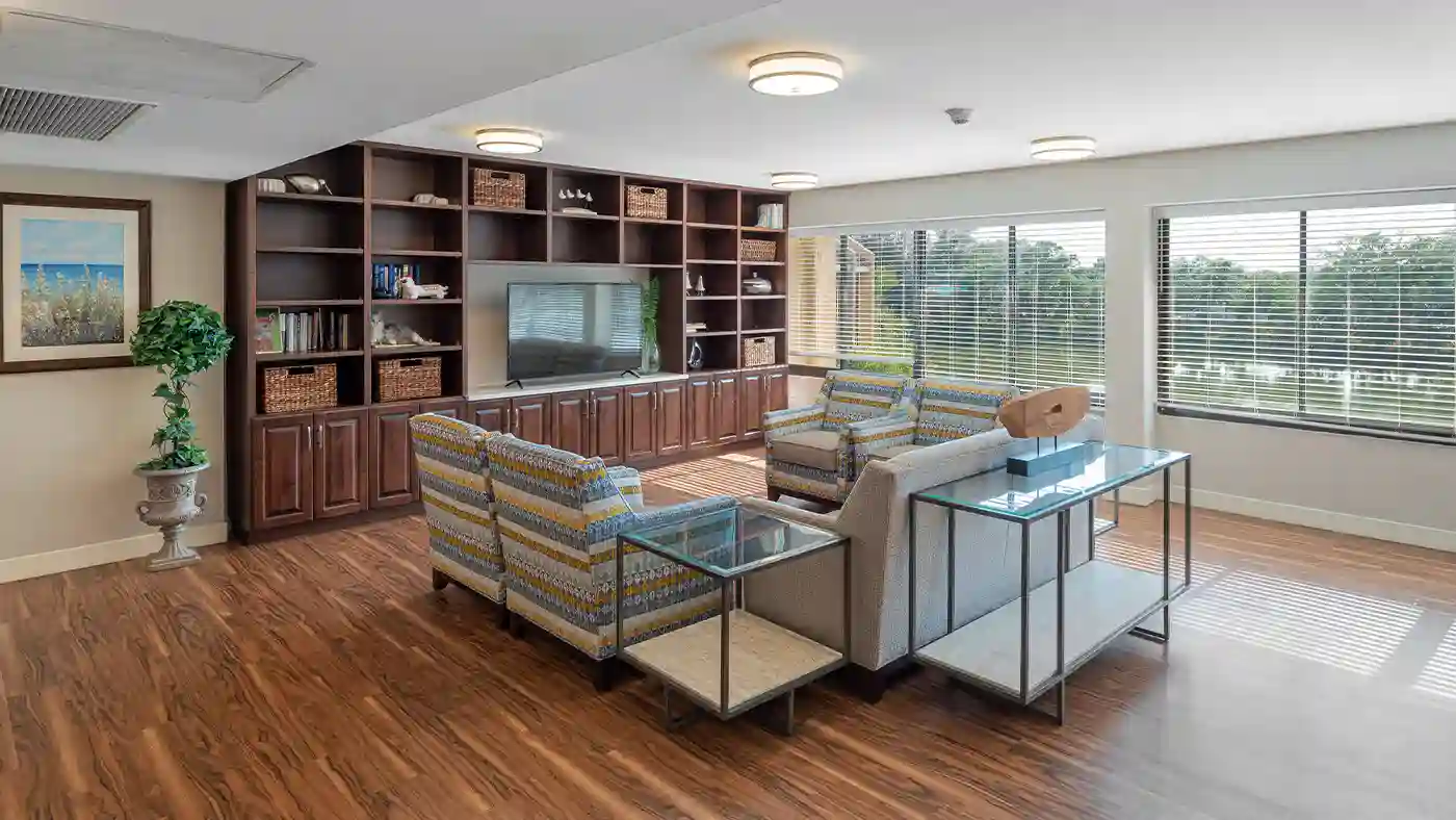 Lounge and Gathering Space with TV at American House Sarasota Senior Living Community adsf