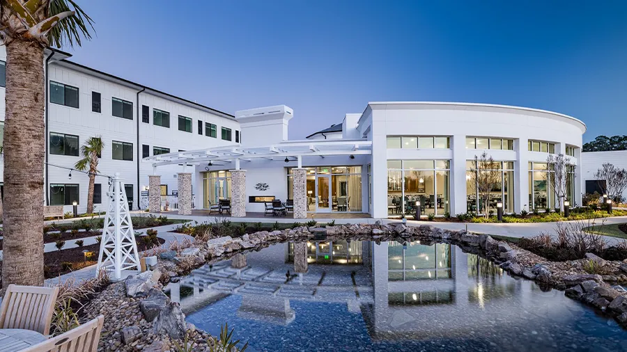 Outdoor courtyard with fountain at American House Myrtle Beach Assisted Living and Memory Care facility