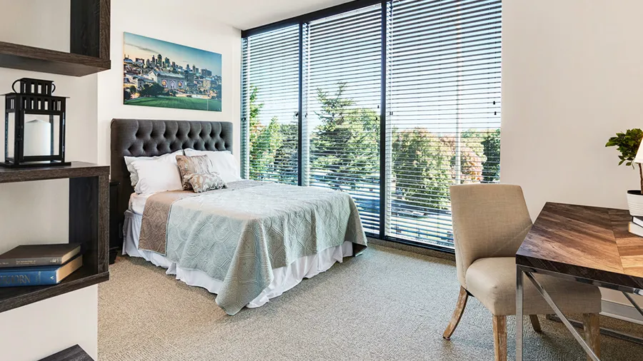 Bedroom in an apartment at American House St. Anthony's Independent Living, Assisted Living, and Memory Care senior living facility in Kansa City, MO
