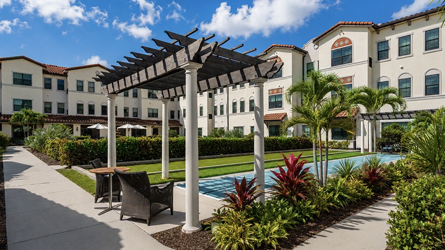 Exterior back view at American House Coconut Point, a senior living community in Estero, FL