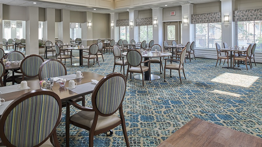 Dining room at American House East II, a senior living community in Roseville, Michigan