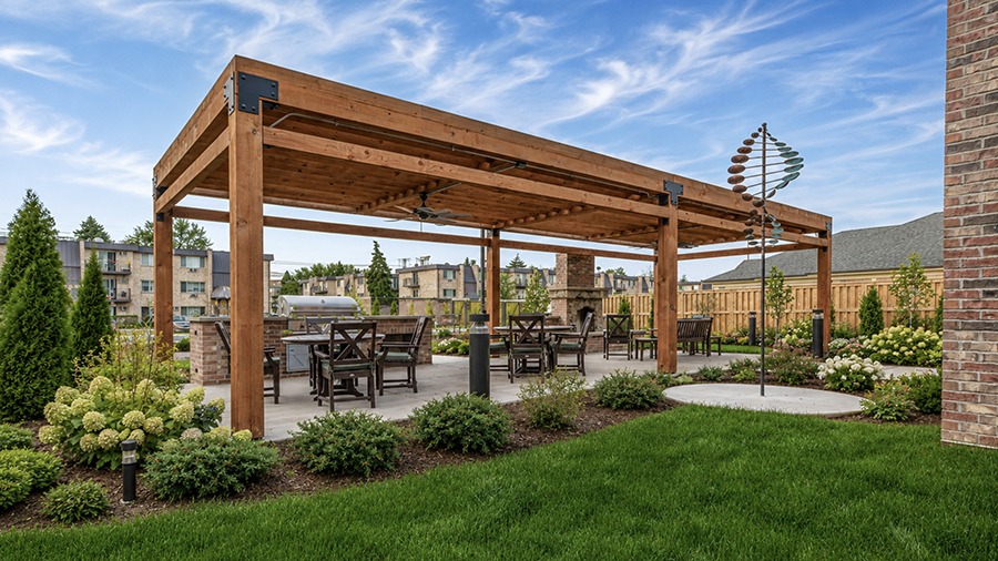 Patio with grill and seating at American House Mount Prospect assisted living and memory care facility in Mt. Prospect, IL