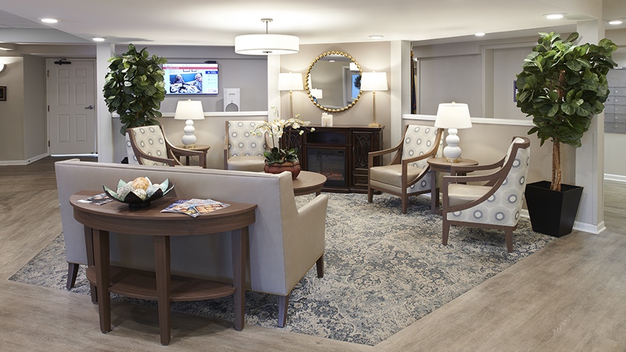 Sitting area with TV at American House Sterling Meadows retirement home in South Sterling Heights, Michigan