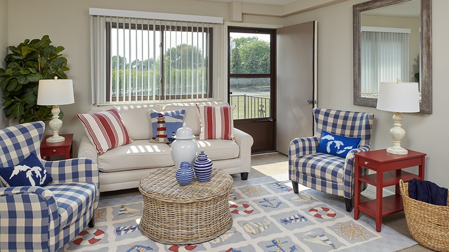 Model living room in an apartment at American House East II, a senior living community in Roseville, Michigan