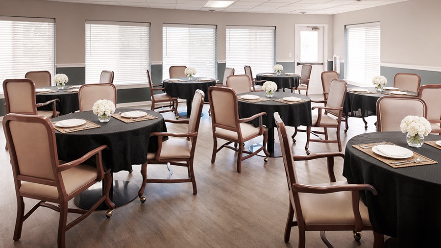 Dining area with roses on tables at elderly home in South Sterling Heights, Michigan