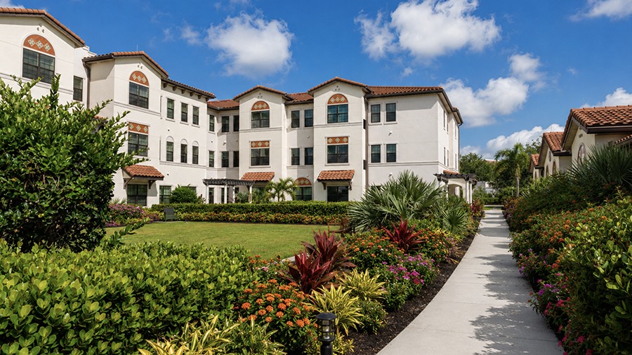 Walking path at American House Coconut Point, a senior living community in Estero, FL