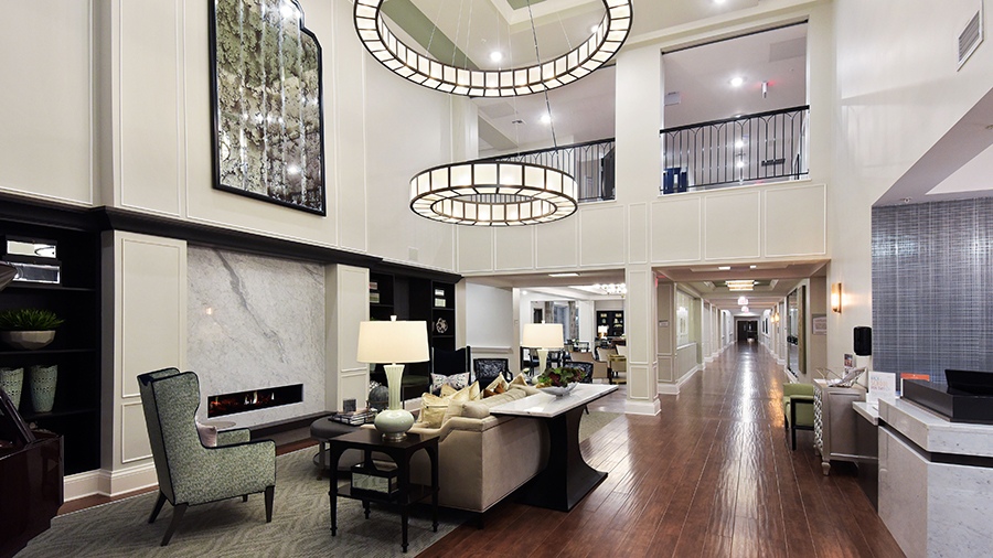 Front desk and lobby at American House Hampton Village assisted living and memory care facility in Rochester Hills, MI