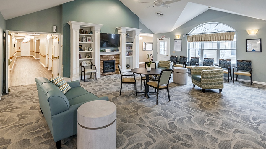 Lounge with fireplace at American House Lebanon memory care and assisted living facility in Lebanon, TN