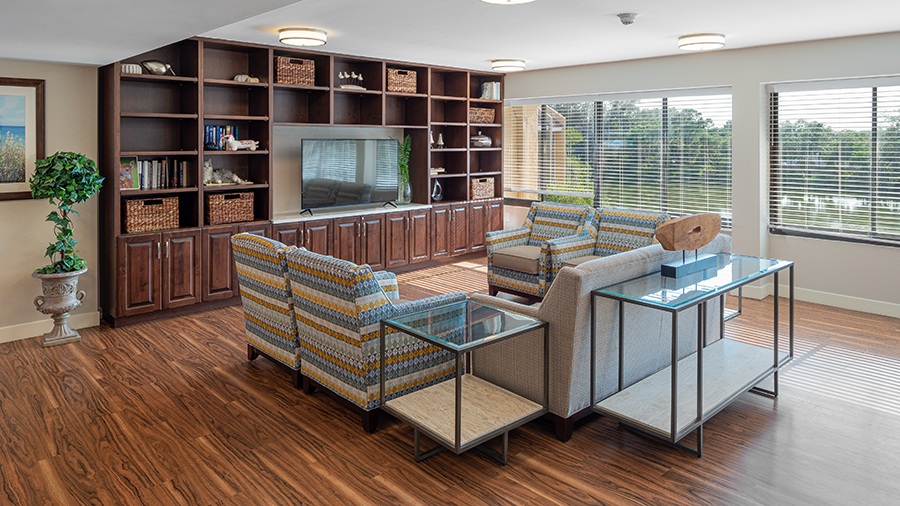 Lounge and Gathering Space with TV at American House Sarasota Senior Living Community