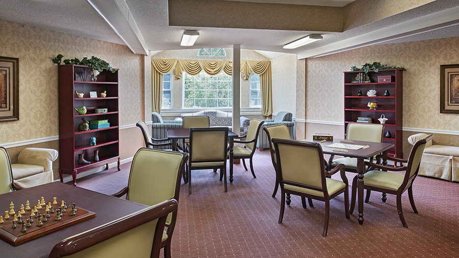 Common area with chess game and word game set up in senior housing in Westland, MI