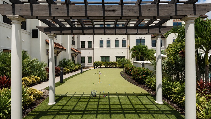 Putting green at American House Coconut Point, a senior living community in Estero, FL