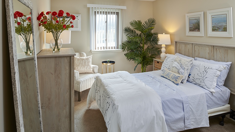 Model bedroom in an apartment at American House East II, a senior living community in Roseville, Michigan