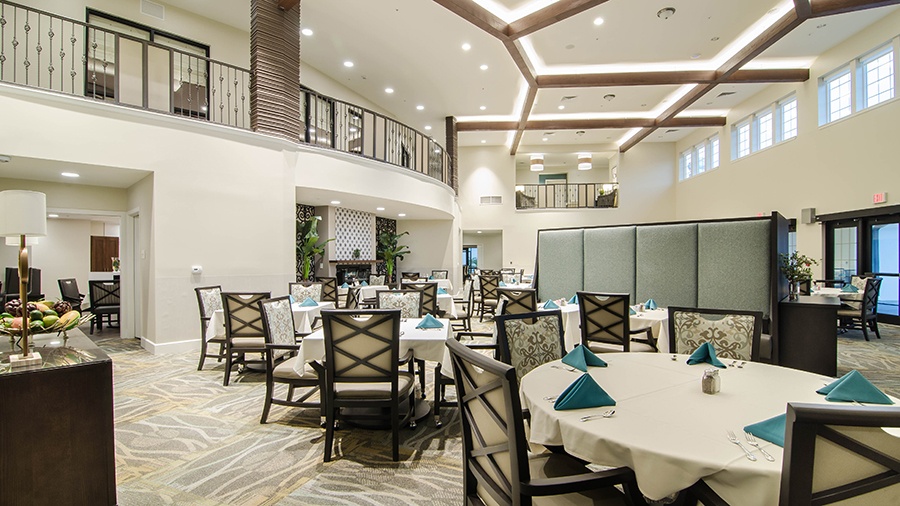 Restaurant style dining room at American House Coconut Point, a senior living community in Estero, FL