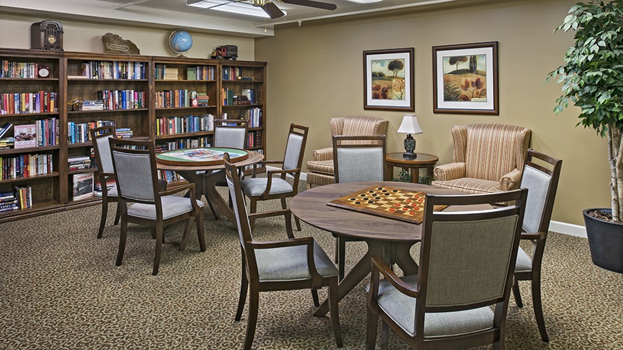Activity room with games and books at American House Petoskey, an assisted living facility in Petoskey, Michigan