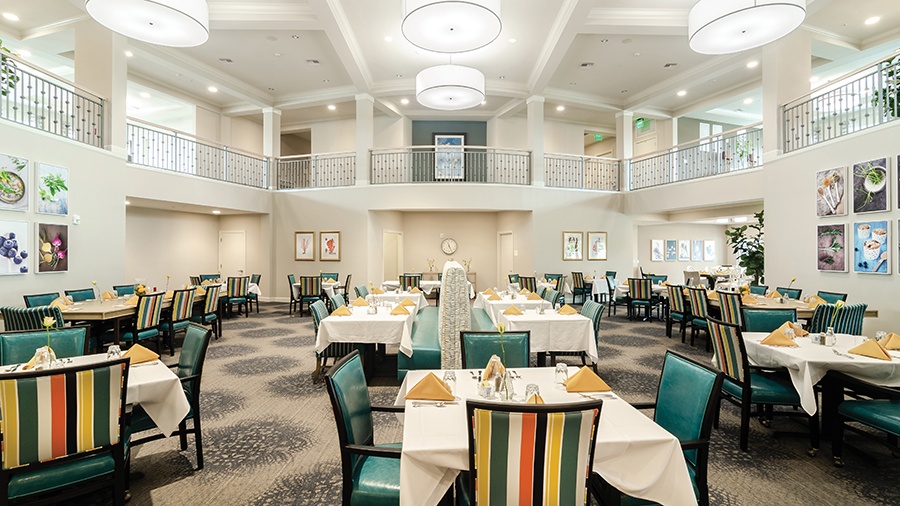 Restaurant style dining room at American House Ft. Myers assisted living and memory care facility in Fort Myers, FL