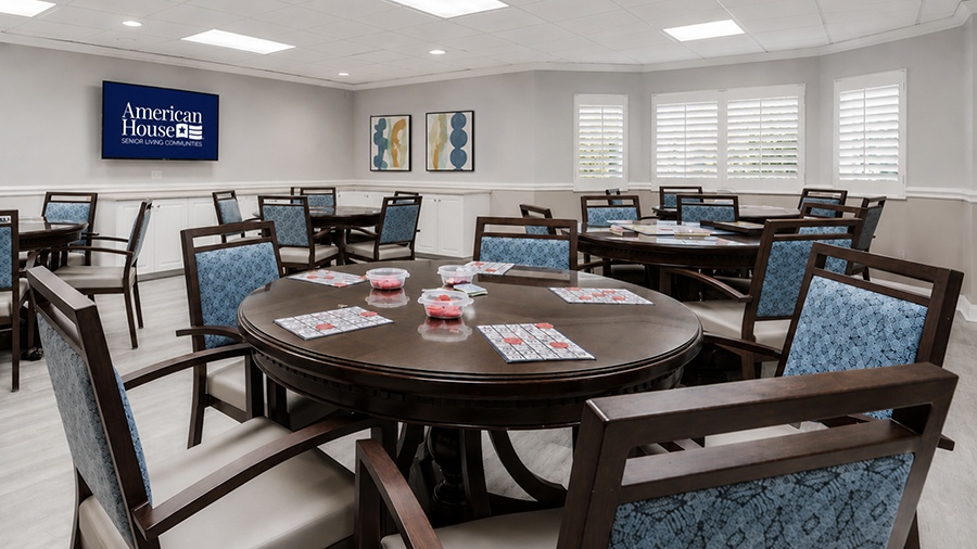 Game and activities room at American House The Palms senior living community in North Fort Myers, FL