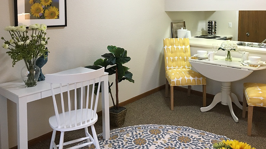 Kitchen and dining nook in an independent living apartment at American House in Westland, MI.
