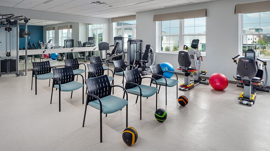 Accessible fitness center and exercise room at American House Boynton Beach, a retirement home in South Florida