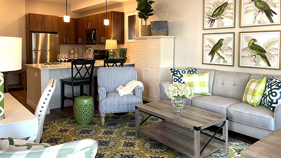 Kitchen and living room in an apartment at American House Oak Park, a luxury assisted living community in Oak Park, Illinois
