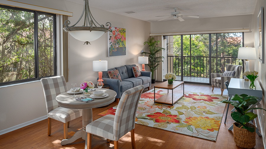Living room and dining area in an apartment at American House Sarasota Senior Living Community