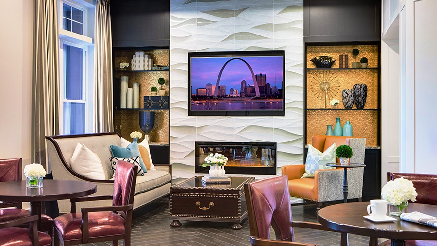 Lounge in common area with comfy seating at American House Town and Country memory care and assisted living facility in Town and Country, MO