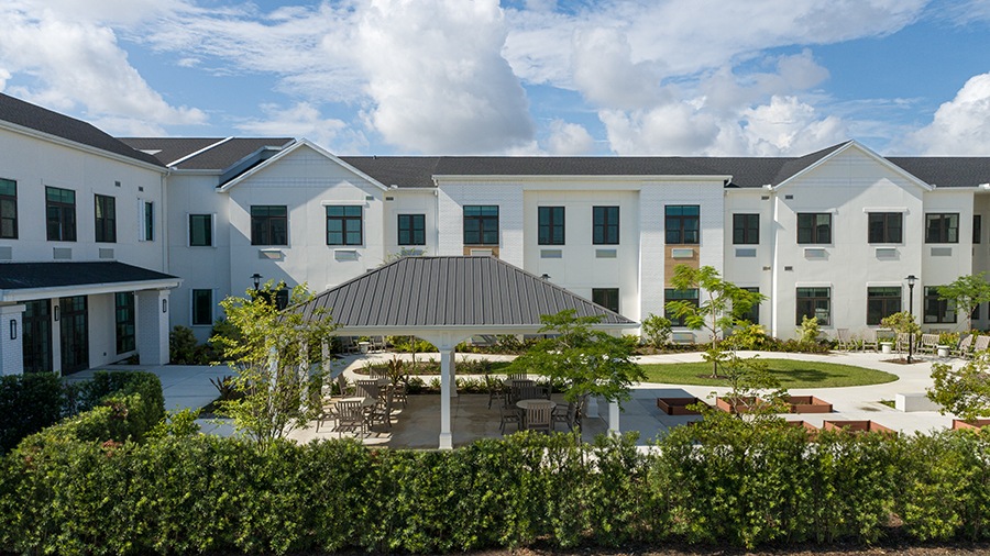 Covered patio at American House Boynton Beach, a retirement home in South Florida