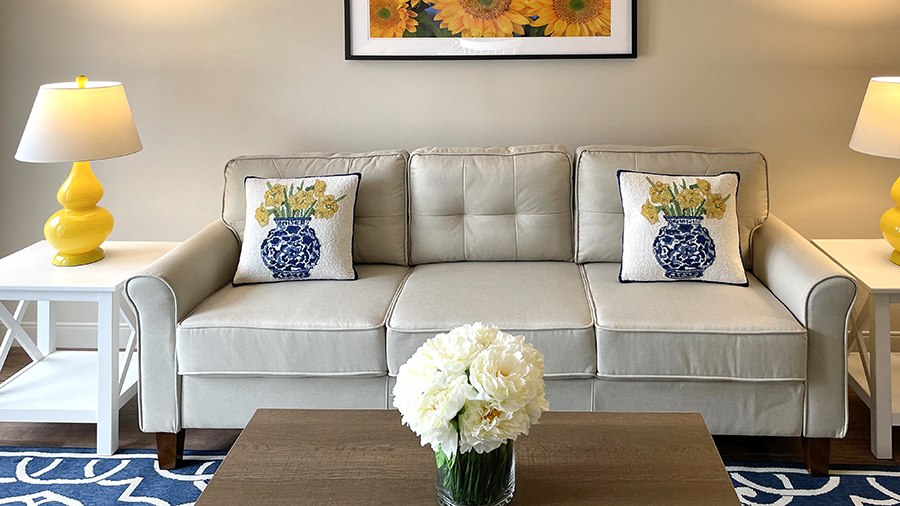 Model Living Room with coffee table at American House Carpenter independent and assisted senior living facility