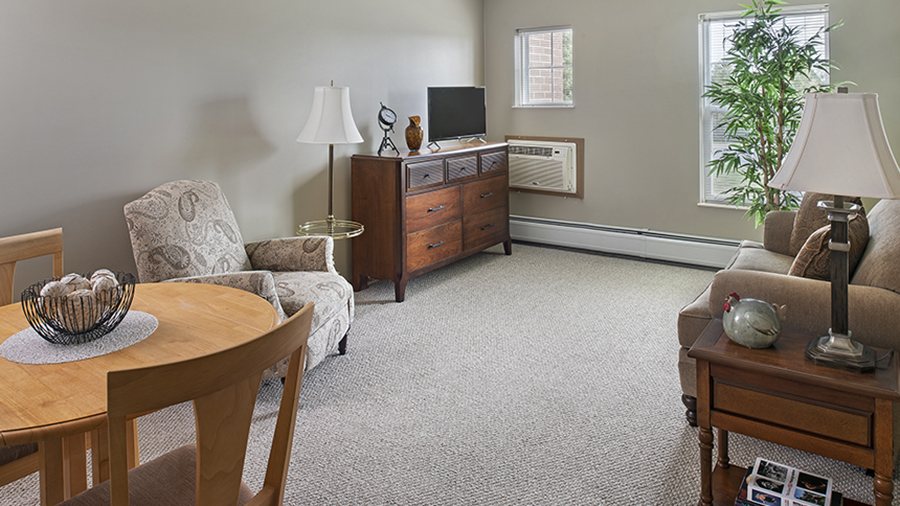 Model living room at American House Cedarlake independent and assisted living facility