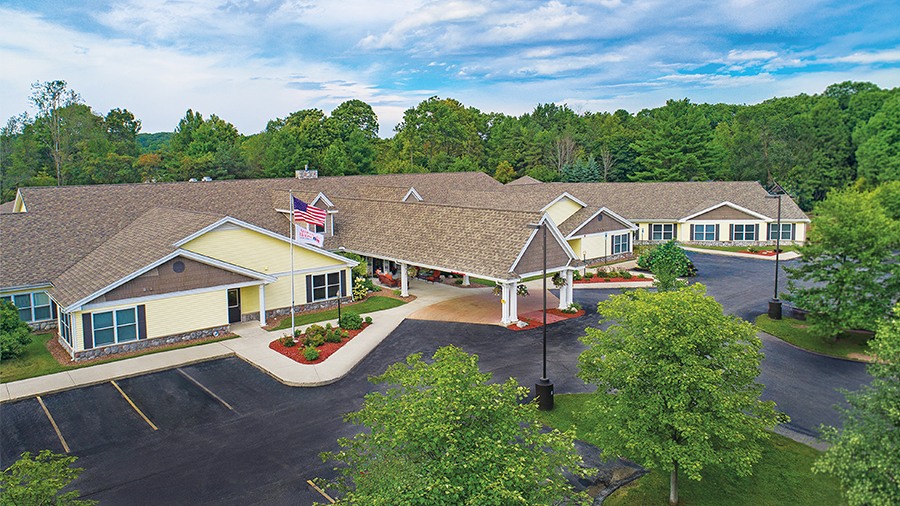 Aerial view of front entrance and driveway at American House Charlevoix senior and assisted living facility