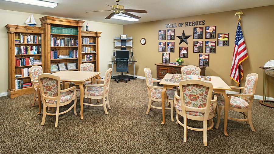 Library with veteran tribute wall of heroes at American House Charlevoix senior and assisted living facility
