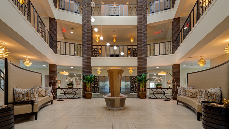 Atrium and interior lobby at American House Coconut Point, a senior living community in Estero, FL