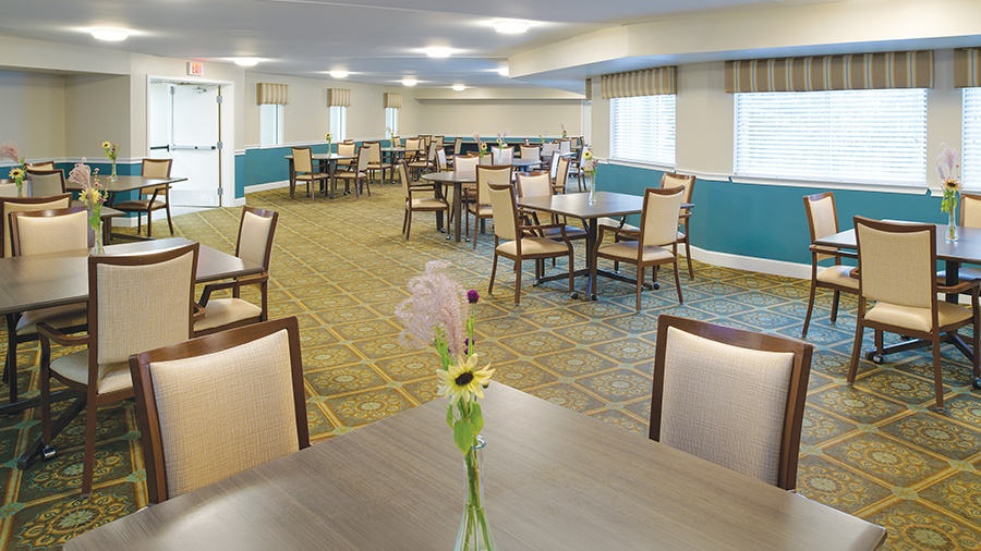 Seating in dining room at American House Grand Blanc assisted living community