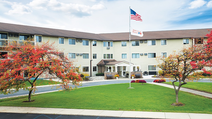 Front entrance and driveway to American House Grand Blanc assisted living community