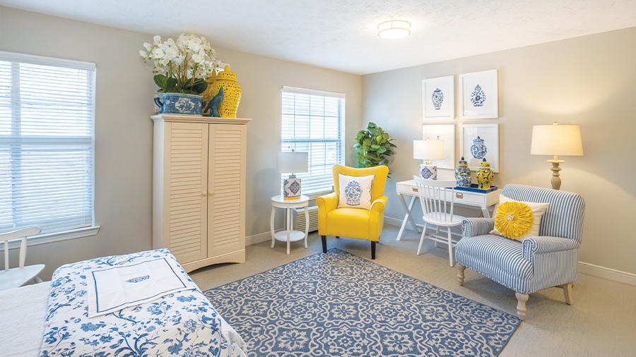 Model bedroom with sitting area at American House in Chattanooga assisted living and memory care facility
