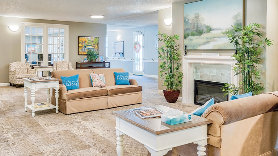 Lounge with fireplace at American House Hendersonville Assisted Living and Memory Care Facility